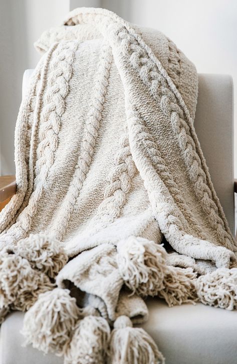 Braided detail adds teture to the soft, cozy fabric of this knit throw charmingly finished with playful pom poms Elegant Throw Blanket, Bed Throw Blankets, Cozy Blanket Aesthetic, Beige Throw Blanket, Tan Throw Blanket, Fall Blankets, Winter Throw Blanket, Pom Pom Throw Blanket, Fall Basket