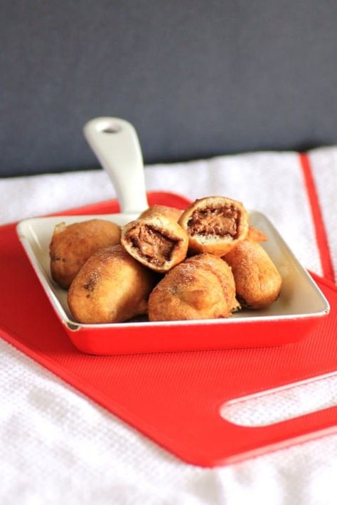 Deep Fried Mars Bars in a small red and white dish with one broken in half on top Deep Fried Mars Bar, Fried Mars Bar, Deep Fried Mars Bars, Fried Desserts, Deep Fried Desserts, Mars Bars, Fried Dessert, Mars Bar, White Dish