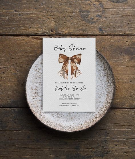 Invite guests to celebrate with this Editable Coquette Cowgirl Baby Shower Invitation Template, perfect for a modern Western girl baby shower. This Western Baby Shower Invite features a charming cowgirl bow design, making it a rustic yet stylish choice for your special day! 🤠 🖤 𝑯𝑶𝑾 𝑫𝑶𝑬𝑺 𝑰𝑻 𝑾𝑶𝑹𝑲? 🖤 Once purchased, you will receive a link to a PDF, which will include your template and instructions for printing and customizing in Canva.  Canva is a free (and easy-to-use) platform and I walk you through how to make simple changes to the template. Once edited, you can download and print anywhere you would like. Add the expectant mother's name, location of the event and more -- all on your own! It's easy and you don't have to wait for a designer to get back to you!  🖤 𝑾𝑯𝑨𝑻 ?