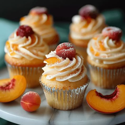 Peach Bellini Cupcakes Peach Cupcakes With Peach Buttercream, Peach Pie Cupcakes, Yellow Birthday Cupcakes, Peach Bellini Cupcakes, Peaches And Cream Cupcakes, Fun Flavored Cupcakes, Creative Cupcake Flavors, Gourmet Cupcakes Fancy, Honey Peach Cream Cheese Cupcakes