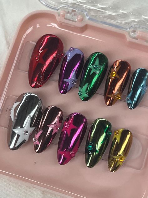 Handmade press on nail set   Order more or custom sizing through instagram Winter Funky Nails, Diva Nails Designs, Full Chrome Nails, Candle Nails, Mixed Chrome Nails, Game Nails, Multi Colored Chrome Nails, Star Chrome Nails, Chrome Art Nails