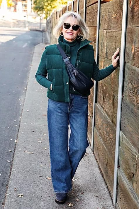 Looking for ideas on how to style a puffer vest? Look no further, A Well Styled Life created the perfect look with a green puffer vest by pairing it with a green turtleneck, wide leg jeans, navy lug sole booties and navy sling bag. Follow for styling tips and outfit ideas for women over 50 and more. Green Vest Outfits For Women, Green Vest Outfit, Looks Festival, A Well Styled Life, Green Puffer Vest, Puffer Vest Outfit, Vest Outfits For Women, Travel Attire, Green Puffer