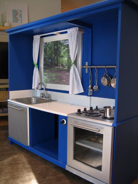 Play kitchen made from an old entertainment center.  So cute!  I want Darren to make one for the kids. Diy Kids Kitchen, Old Entertainment Centers, Play Kitchens, Kids Play Kitchen, Entertainment Center Kitchen, Entertainment Cabinet, Entertainment Center Repurpose, Diy Play Kitchen, Entertainment Center Decor