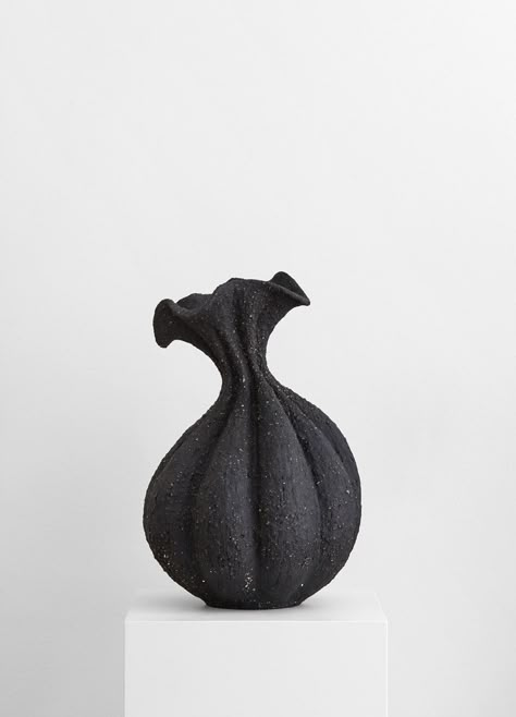 DESIGN | There’s something other-worldly about Malene Knudsen’s sixteen-piece collection of vases. Based on familiar organic shapes influenced by the natural world. The glimpse of a seed head, the curve of a spine, the bud of a flower. | art, artist, clay, ceramics, décor, black Tall Flower Vase, Large Flower Vases, Nordic Interiors, Flower Vase Making, Recycled Brick, Porous Materials, Telling Stories, The Low, Small Vase