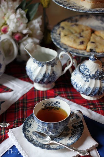 A cozy Tea with scones, transferware, plaid cloth, linen napkins, silver and, of course, flowers. Blue And White Dishes, Cuppa Tea, White Dishes, English Tea, George Orwell, A Cup Of Tea, Christmas Tea, My Cup Of Tea, Tea Art