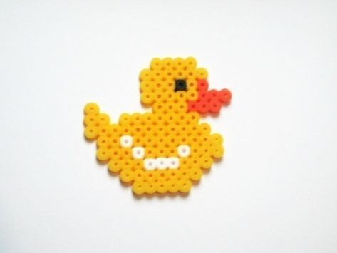 Rubber duckie , your the one! . Make a pegboard bead charm in under 10 minutes by pegboarding with perler beads. Inspired by animals and birds. Creation posted by Harmini A. Difficulty: Easy. Cost: No cost. Animal Pearl Beads, Duck Pearl Beads, Rubber Duck Perler Beads, Bead Duck Pattern, Perler Bead Patterns Duck, Rubber Duck Craft, Rubber Duck Crafts, Diy Rubber Duck, Duck Perler Beads