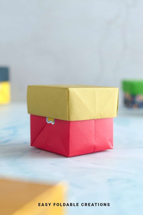 Origami Box With Lid | Easy Foldable Creations Origami Candy Box, Origami Snake, Origami Candy, Origami Pumpkin, Origami Box With Lid, Origami Box Easy, Christmas Tree Napkin Fold, Origami Box Tutorial, Origami Boxes