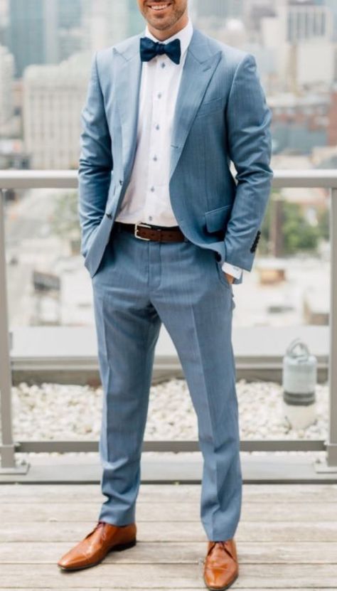 a light blue suit, a white shirt, a navy bow tie, a brown belt and amber shoes Wedding Suits Men Blue, Navy Bow Tie, Light Blue Suit, Mens Wedding Attire, Groom Wedding Attire, Groom And Groomsmen Attire, Wedding Suits Groom, Spring Wedding Colors, Wedding Groomsmen