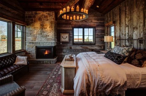 rustic bedroom featuring a fireplace with a beautiful stone surround and hardwood flooring located in Woodland, Utah. (via Magleby Construction) Cabin Style Bedroom, Log Cabin Bedrooms, Log Cabin Bedroom, Cabin Bedrooms, बेडरूम डिजाइन, Rustic Bedroom Design, Cabin Bedroom, Log Cabin Homes, Cabin Style