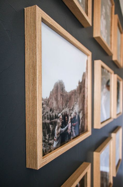 Are you curious on how to hang you photos? Check out this post all about how hang your gallery wall photos in this modern grid pattern! We give all the details and show you how our gallery came out! #gallery #modern #grid #decor Photo Wall Grid, Wooden Frames On Wall, 8x10 Photo Wall Display Ideas, Photo Grid Design, Photo Frames On The Wall, Gallery Wall Photos, Grid Gallery Wall, Grid Decor, Christmas Status