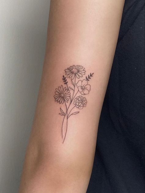 September Birth Month Tattoo, Feminine Back Of Arm Tattoo, Daisy Tattoo On Arm, Floral Tattoo On Back Of Arm, Floral Simple Tattoo, Birth Flower Tattoos Above Elbow, January And February Birth Flower Tattoo, Flower Tattoo Behind Arm Above Elbow, Simple Birth Flower Tattoo