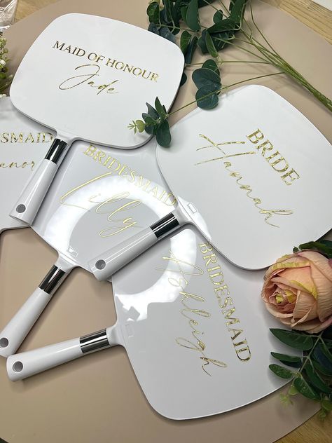 It's the final touches that make your big day so special and our personalised mirrors for your bridal party will do just that! 🤩 ✨ Personalised bridal mirrors  ✨ Beautiful gift for you bridal party to treasure forever and also makes for a beautiful photo prop for the getting ready pics 📸 ✨22cm x 19cm without handle ✨Gift tags can be added to the handle with ribbon, please either leave your details in the notes to seller section or inbox us to discuss ✨Personalisation is made using adhesive vin Bridal Proposal Decorations, Gift For The Bride From Bridesmaids, Bridesmaid Wedding Day Gifts Mornings, Wedding Day Gifts For Bridesmaids, Bridesmaid Gifts Day Of Wedding, Gifts For Bride On Wedding Day, Day Of Wedding Bridesmaid Gifts, Bridesmaid Gifts From Bride Day Of, Bridal Suite Decorations