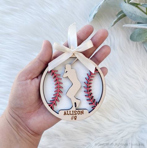 How fun are these adorable Baseball themed Christmas ornaments for your sport lover or Cheerleader.  These would also make a great gift for the team.  Both personalized and non-personalized options available.   These ornaments are made from wood and are laser cut and engraved (if personalized). Background is painted using matte acrylic paint so there is no shine to it so it matches the raw wood finish of the top layer.  They can be mounted on your choice of ribbon color.   Many sports available. Baseball Christmas Ornaments, Baseball Ornaments, Custom Bag Tags, Baseball Christmas, Baseball Crafts, Kids Christmas Party, Themed Christmas, Personalized Baseballs, Personalized Towels