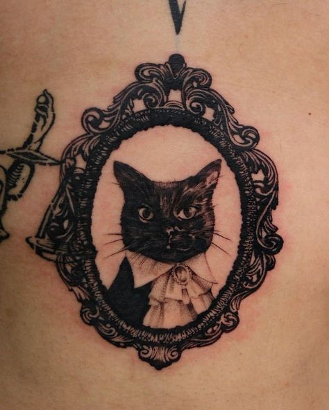 6 O 9 | His cat :) Done at @_atelierpearl | Instagram Russian Cat Tattoo, Kit Cat Clock Tattoo, Salem Cat Tattoo, Victorian Cat Tattoo, Cat Frame Tattoo, Vampire Cat Tattoo, Black Cat Portrait Tattoo, Tortoise Shell Cat Tattoo, Celestial Cat Tattoo