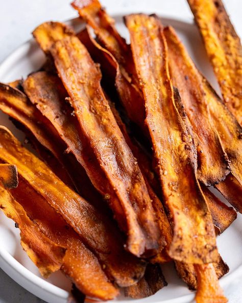 This vegan carrot bacon is a deliciously sweet and smoky alternative to bacon! It's easy to make with a simple marinate and can be oven baked or air fried. Delicious on burgers, with your vegan breakfast or sprinkled over salad. #carrot #bacon #vegan