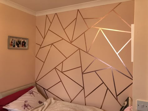 Rose gold washi tape to create a feature wall, two and half rolls of 10 meter long tape used Tape Wall Painting, Bedroom With Rose Gold Accents, Gold Feature Wall, Wall Taping Design, Geometric Wall Tape Design, Girl Bedroom Walls Paint, Rose Gold Accent Wall, Tape Wall Design, Wall Tape Designs