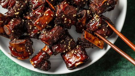 The recipe for sticky spare ribs with Chinkiang vinegar is one of many that can be found in the pages of "A Very Chinese Cookbook" by Kevin and Jeffrey Pang, a son and his father who co-authored the America's Test Kitchen cookbook. (Courtesy Kevin White/America's Test Kitchen) Pork Riblets, Black Vinegar, Cooking Chinese Food, Family Dishes, Kitchen Cookbook, America's Test Kitchen, Asian Foods, Braised Pork, Spare Ribs