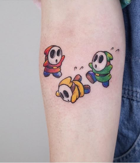 Shy Guy Mario Tattoo, Mario Sibling Tattoos, Paper Mario Tattoo Ideas, Shy Guy Tattoo Design, Yoshi Tattoos Ideas, Cute Mario Tattoo, Mario Themed Tattoos, Mario Matching Tattoos, Simple Mario Tattoo