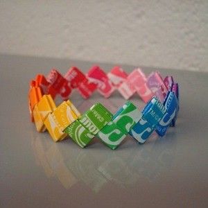 DIY project in which you can recycle Starburst wrappers and turn them into bracelets! Starburst Bracelet, Candy Wrapper, Origami 3d, Candy Wrappers, Over The Rainbow, Origami Paper, Art Plastique, A Rainbow, Kids Crafts