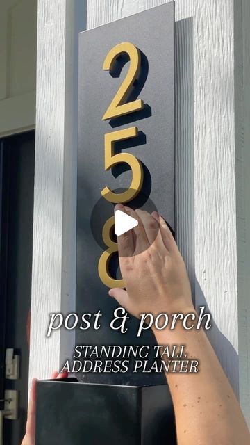 Post & Porch on Instagram: "Our fully customizable Standing Tall Address Planter is the perfect addition to your porch this summer 🤩

✨comes in four different finishes with address numbers in silver, bronze, or black

✨compatible with faux or live plants thanks to drainage holes in the bottom

✨part of our 30% OFF Memorial Day sale, going on now!!!
.
.
.
.
.
.
.
#viralvideos #viralproducts #memorialdayweekend #porchdecor #curbappeal #exteriordesign #summertrends #outdoorliving" Diy Address Sign House Numbers, House Numbers Ideas Outdoor, Diy Address Sign, Address Planter, House Address Sign, Memorial Day Sale, Address Numbers, Outdoor Diy Projects, Making Crafts