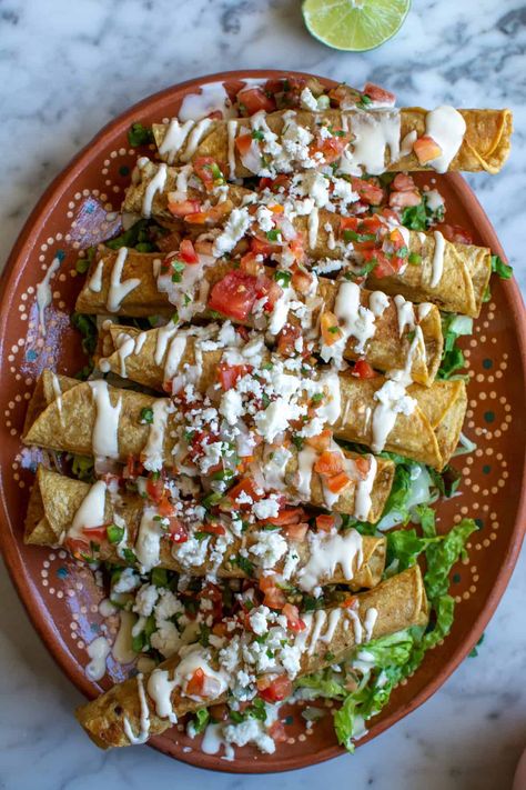 Chicken Flautas Mexicanas - ¡HOLA! JALAPEÑO Mexican Family Dinner, Authentic Mexican Taquitos, Mexican Dinner Ideas Authentic, Dinner Ideas Mexican Authentic, Mexican Wedding Food, Mexican Street Food Snacks, Ranchera Sauce, Flautas Ahogadas, Mexican Flautas