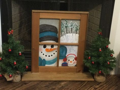 Snowman peeking in the window. I found this old shelf at Goodwill. I took the existing fabric off the back & decided to paint a scene on a 16x20 canvas board to attach to the window. I think I will paint different seasonal scenes to change it out. Snowman Painted Windows, Christmas Window Painting Snowman, Painted Snowman On Glass Old Windows, Snowman Looking Up Painting, Dog Looking Out Window Painting, Canvas Board, Holiday Decor, Frame, Canvas