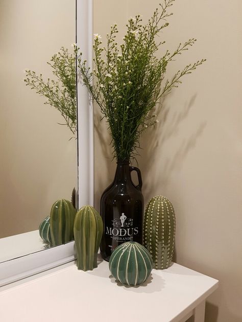 Repurposed Growler from Modus Operandi Brewing #growler #beerdecor #decor #cactus #ikea #interior #flowers #succulent Growler Decor Ideas, Growler Repurpose, Beer Growler Decor, Desert Bathroom Decor, Growler Decor, Beer Bottle Decor, Southwest Living, Beer Decorations, Top Of Cabinets