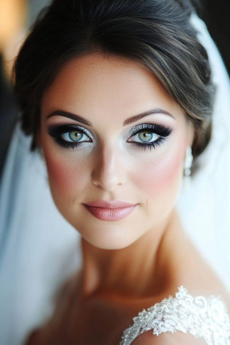 Over 50 glamorous bridal makeup ideas that blend bold colors, dramatic eye accents, and glowing finishes. From classic beauty to high-impact glam, these styles cater to every type of bride. Ready to stand out and feel radiant? Explore all the stunning options here! #bridalmakeuplooks #weddinginspo #makeuptrends Blue Eye Bride Makeup, Blue Bride Makeup, Elegant Wedding Makeup Brides Blue Eyes, Blue Eye Wedding Makeup, Wedding Day Makeup For Bride Blue Eyes, Bride Makeup Blonde, Light Blue Makeup, Dramatic Bridal Makeup, Winter Wedding Makeup