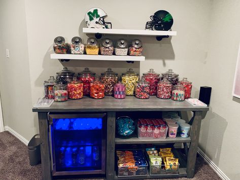 Living Room Snack Bar Ideas, Snack Setup For Room, Movie Theater Rooms Snack Bar, Games Room Snack Bar, Small Basement Hangout Room, Game Room Ideas For Couples, Home Theater Candy Display, Bar And Snack Area, Snack Bar In Room