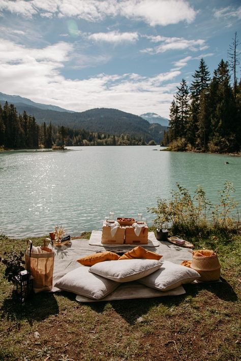 A picnic set up complete with pillows, blankets, and a charcuterie board by the lake in Whistler, BC Proposal In The Woods, Proposal Picnic Set Up, Proposal Ideas Picnic, Proposal Set Up, Casual Wedding Dinner, Proposal Set Up Ideas Outside, Engagement Set Up Ideas, Proposal Intimate, Picnic Proposal Ideas