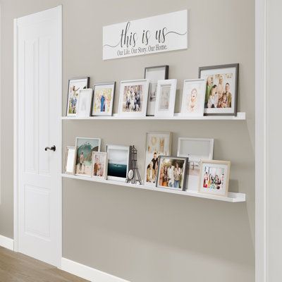 These wood shelves for walls will help you to transform any dull space into wall art! You will receive 2 narrow wall bookshelves. Install them the way you want and display your favorite pictures, family photos, and more to complete your home decor. | Latitude Run® DENVER Ledge, 84" White, 2Pcs Wood in Brown / White, Size 1.6 H x 84.0 W x 1.6 D in | Wayfair | Home Decor Floating Shelves With Pictures Around, White Long Shelf, Bedroom Photo Shelf, Ledge Picture Shelves, Memory Corner At Home, Floating Shelves With Frames, Wedding Photo Display Shelf, Floating Shelf Photo Display, Photo Shelf Wall