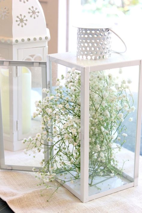 Hardy yet willowy baby's breath gives an angular lantern a secret-garden vibe. Get the tutorial at Melissa Creates »  - GoodHousekeeping.com Spring Lantern Decor Ideas, Spring Lantern Decor, Decorating With Lanterns, Spring Lanterns, Lantern Decorations, Spring Lantern, Rustic Arrangements, Lantern Decor, Candle Wedding Centerpieces