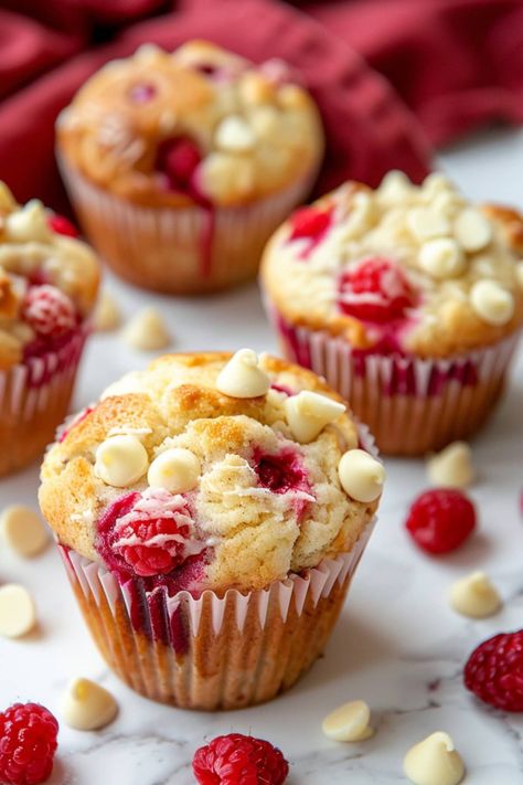 These white chocolate raspberry muffins are an ideal treat for any time of the day. Between the juicy berries and creamy chocolate, they're insanely good. Berry White Chocolate Muffins, White Chocolate And Raspberry Muffins, White Chocolate Raspberry Muffins, Healthy Raspberry Muffins, Raspberry Chocolate Chip Muffins, Raspberry White Chocolate Muffins, Chocolate Raspberry Muffins, Gathering Recipes, Raspberry Cupcake Recipes