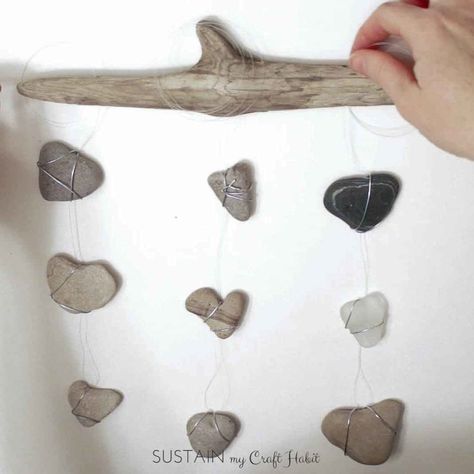 DIY Nautical Decor: Heart Rocks and Sea Glass Mobile #bedroom #decor #driftwood-crafts #heart #natural-decor #rocks #sea-glass #stones #valentines #wall-hanging#beach-decor #indoor-spaces #nature-crafts #sustainmycrafthabit Projects With Rocks, Diy Rocks, Diy Nautical Decor, Diy Nautical, Rock Creations, Heart Rocks, Glass Mobile, Heart Shaped Rocks, Nautical Diy