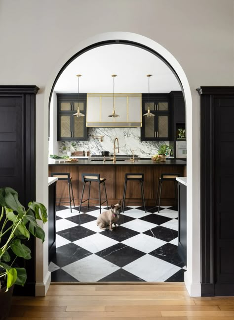 Overview East Coast meets West Coast in this gorgeous historic Colonial which was built in 1900 for A.D. Puffer, the... Entryway Into Kitchen, Arched Entryway, Kitchen Black And White, Closet Revamp, Walnut Island, Arched Entry, Black And White Tile, House Remodeling, Eclectic Kitchen