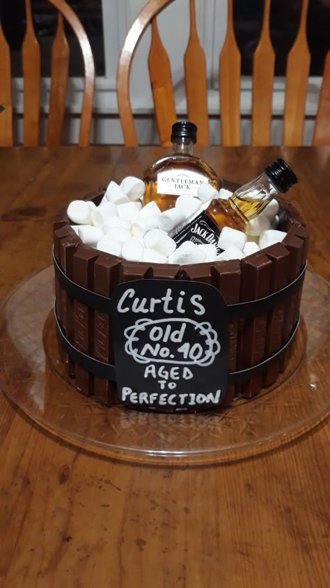 Brownies cut into circles stacked, kit kats around edges, & filled with marshmallows. Topped with little bottles of JD. Cake With Bottles On Top, Alcohol Bottle Cake, Cake With Alcohol Bottles On Top, Liquor Bottle Cake, Liquor Cake, Whiskey Cake, 40th Cake, Birthday Cake For Husband, Bottle Cake