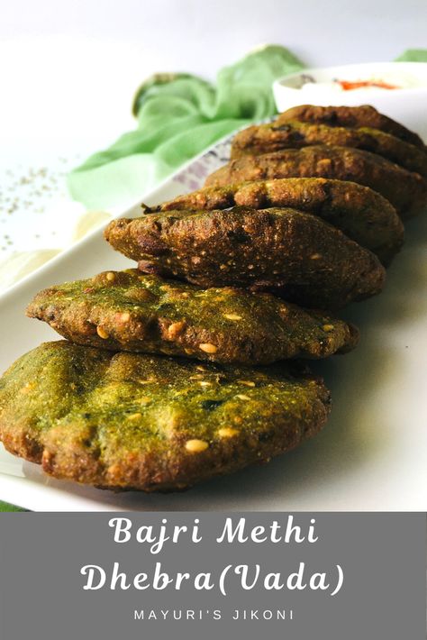 Soft and tasty Bajri Methi Dhebra or Vada is a fried Gujarati snack. Enjoy it with some yogurt or with masala tea. Include pearl millet or bajra and fresh fenugreek (methi) in your diet. #snacks #millet gujaraticuisine #inidancuisine #fenugreek Methi Recipe, Dinner Board, Vegetarian Platter, Gujarati Cuisine, Gujarati Snacks, Pearl Millet, Modernist Cuisine, Asian Recipe, Millet Flour