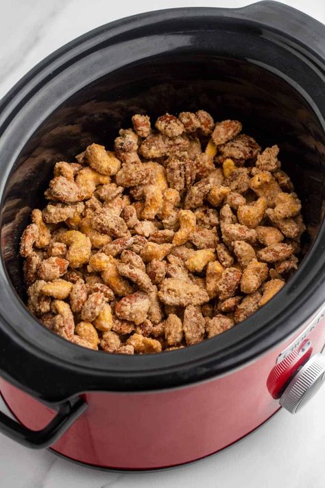 Crockpot Candied Nuts - This easy make-ahead holiday snack is perfect for gifting or to serve as an appetizer at parties. Mixed nuts are covered in cinnamon sugar and cooked to perfection in a Crockpot to make a tasty, addicting treat. Crockpot Roasted Nuts Crock Pot, Candied Walnuts Crockpot, Crockpot Nuts Christmas, Slow Cooker Nuts Recipes, Crockpot Candied Nuts Recipe, Candied Almonds Crockpot, Mixed Nuts Recipes Snacks, Candied Nuts Recipe Easy, Honey Roasted Cashews Recipe