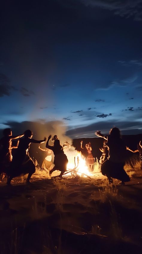 Dancing by Firelight: Silhouetted figures dance energetically around a roaring campfire under the twilight sky, celebrating the night. #dancing #campfire #twilight #silhouette #figures #celebration #night #fire #aiart #aiphoto #stockcake https://ayr.app/l/4CeU Women Dancing Around Fire, Litha 2024, Dancing Around Fire, Dancing Around A Fire, Outdoor Dance Party, Wild Dancing, Campfires Photography, Silhouette Figures, Dancing In The Forest