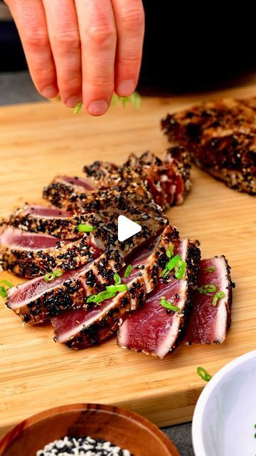 Ryan Carter 🍻 on Instagram: "Pan Seared Ahi Tuna.

This Pan Seared Ahi Tuna is fresh, flavorful, and perfect when you want something light yet filling. Fresh ahi tuna crusted in a mixture of sesame seeds, brown sugar, and garlic and onion seasonings. Sprinkle with @maldonsalt smoked sea salt - BOMB!

INGREDIENTS
*Makes 2 lbs

2 lbs sushi grade ahi tuna steaks (about 1.5-2 inch thickness)

MARINADE
+ 3 TBSP soy sauce
+ 1 tsp sesame oil

SESAME CRUST
+ 1/3 C sesame seeds
+ 1 TBSP brown sugar
+ 1 tsp garlic powder
+ 1 tsp onion powder
+ 1 tsp salt

Serve with smoked sea salt and sliced green onion.

DIRECTIONS

+ STEP 1: MARINADE
Combine the soy sauce and sesame oil in a shallow dish and then fully coat the ahi on all sides. Let the ahi sit at room temperature for ab Sides For Seared Ahi Tuna, Tuna Tataki Recipe, Pan Seared Ahi Tuna, Cooking Ahi Tuna, Pan Seared Tuna Steak, Seared Tuna Steak, Tuna Marinade, Fresh Tuna Recipes, Sesame Seared Tuna