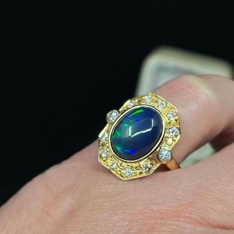 We love this solid Opal ring, if anything it has a bit of an air of 1980’s spunk 😁 The oval solid Opal originates from Ethiopia and its bezel set within an Etruscan reminiscent boarder in 18K yellow gold, set with 12 round brilliant cut Diamonds which are graded in the setting, G to light Champagne. We know how we feel about Champagne Diamonds 🫠🥂 This Opal is dominantly azure blue with flashes of apple green and carnelian. 👌🏽we love it. This ring is now reduced half price making it totally... Blue Mountains Australia, Emerald Cut Rings, Emerald Engagement Ring Cut, Azure Blue, Art Deco Engagement Ring, Half Price, Champagne Diamond, Apple Green, Art Deco Ring