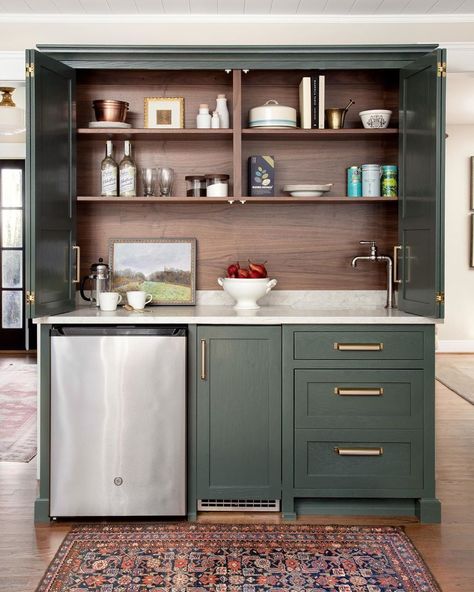 Georgia Hoyler on Instagram: “I adore this lovely green wet bar with stained woodgrain inside! That small vintage rug defines the space and seals the deal for me.…” Hidden Bar Cabinet, Kitchen Wet Bar, Hidden Bar, Small Sink, Coffee Bar Home, Green Cabinets, Wet Bars, Wet Bar, Bar Cabinet