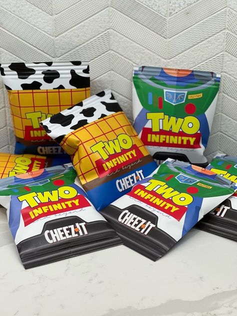 Toy Story Themed Birthday Party Walmart, Toy Story Box Table, Toy Story Birthday Party Treat Table, Toy Story Birthday Candy Table, Toy Story Party Treat Table, Two Infinity And Beyond Birthday Tables, Toy Story Party Food, Buzz Lightyear Birthday Party, Buzz Lightyear Birthday