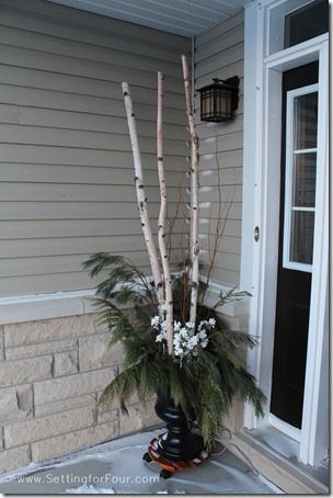 Decorate the outside of your home for winter with DIY urns filled with fresh pine, curly willow and artificial berries and pine poles. See mine on my front porch! Birch Tree Decor Christmas, Decorating With Nature, Birch Tree Decor, Christmas Urns, Outdoor Christmas Planters, Winter Door Decorations, Winter Wreath Diy, Holiday Planter, Outside Christmas Decorations