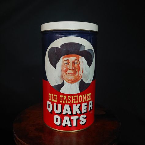 If you enjoy collecting vintage advertising - particularly old tins, this Old Fashioned Quaker Oats container is an interesting piece to add to your collection.  Made in 1982, the design of this tin is very familiar as their branding has been consistent for so many years.  The man on the front of the tin, with his long white hair and wide brimmed black hat, is unmistakable!  Their slogan, which is printed on top of the lid, says "One of Nature's Most Perfect Foods."  The back of the canister shows the recipe for Famous Oatmeal Cookies. There are a couple of scratches here and there, but overall this 40+ year old piece is in amazing condition with bright colors and crisp graphics.  The inside is super clean as well! This is a great way to add some vintage flair to your country or farmhouse Cookie Jar Display, Quaker Oatmeal, Jar Display, Quaker Oats, Oats Quaker, Rustic Hardware, Tin Canisters, Oatmeal Cookie Recipes, Country Kitchen Decor