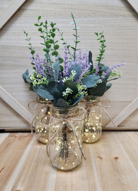 lavender eucalyptus wedding - Google Search Purple Garden Wedding Decor, Lavender In Mason Jars, Lilac Mason Jar Centerpieces, Lilac Eucalyptus Wedding, Sage And Lavender Centerpieces, Lavender Center Piece Wedding, Cottagecore Wedding Table Decor, Dark Purple And Dusty Blue Wedding, Lavender Mason Jar Centerpiece