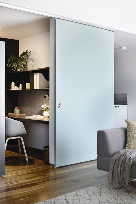 Sliding blue door opens to home office and grey desk chair Home Office Doors, Melbourne Apartment, Sliding Door Design, Study Nook, Sliding Doors Interior, Design Del Prodotto, Barn Doors Sliding, Home Office Design, Design Case