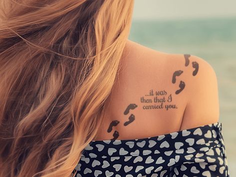 6 Jesus Tattoo Designs For Women | Popular Christian Tattoos - Beliefnet Footprints In The Sand Tattoo, Jesus Tattoo Design, Biblical Tattoos, Tattoo Quotes About Life, Christian Sleeve Tattoo, Jesus Tattoo, Back Of Shoulder Tattoo, Shoulder Tattoos For Women, Small Tattoos For Guys