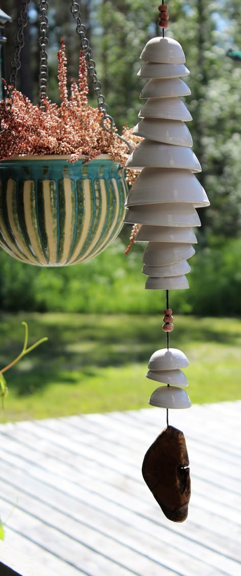 HANDMADE CERAMIC WIND CHIME Ceramic wind chime with a wooden disc at the bottom. The cups are wheel thrown one by one, and hand glazed. Two colour options. ✽ DIMENSIONS ✽ Length: 23.6-25.6 in (60-65 cm) Width: 3.1-3.9 in (8-10 cm) ✽ CARE INSTRUCTIONS ✽ Recommended to take indoors for the winter. During the summer fine outside. ✽ ENVIROMENTALLY FRIENDLY SHIPPING ✽ I ship all my products from Finland. Shipping abroad will take approximately 1-3 weeks. Most of the packing materials I use have been Art Auction Projects, Miniature Pottery, Ceramic Bell, Sculptures Céramiques, Garden Pottery, Hand Built Pottery, Pottery Crafts, Diy Pottery, Ceramics Pottery Art