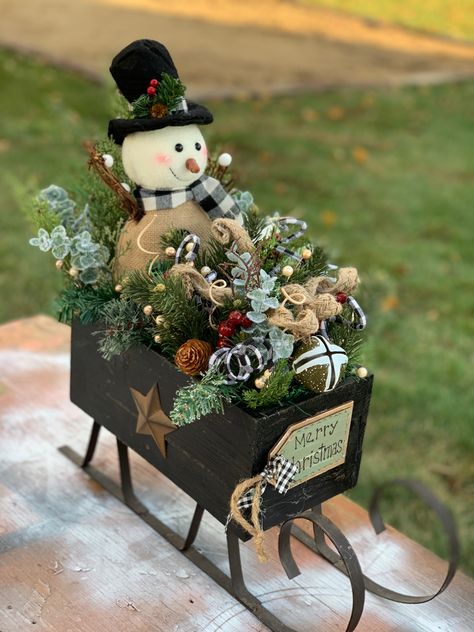 Rustic snowman in a rustic sleigh ready for winter, added hokiday decor to top it off Decorate A Sled For Christmas, Decorating A Sleigh For Christmas, Table Top Sleigh Decorating Ideas, Christmas Sleigh Ideas, Diy Sled Decoration, Decorated Sleighs For Christmas, Small Sleigh Decorating Ideas, Diy Christmas Sleigh Decor, Sleigh Decorating Ideas Christmas